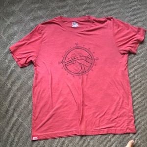 Light red worn in T Shirt. Compass on front